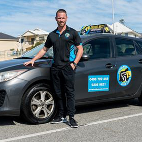 Dirk Zarb Cousin beside a Driving West learner car