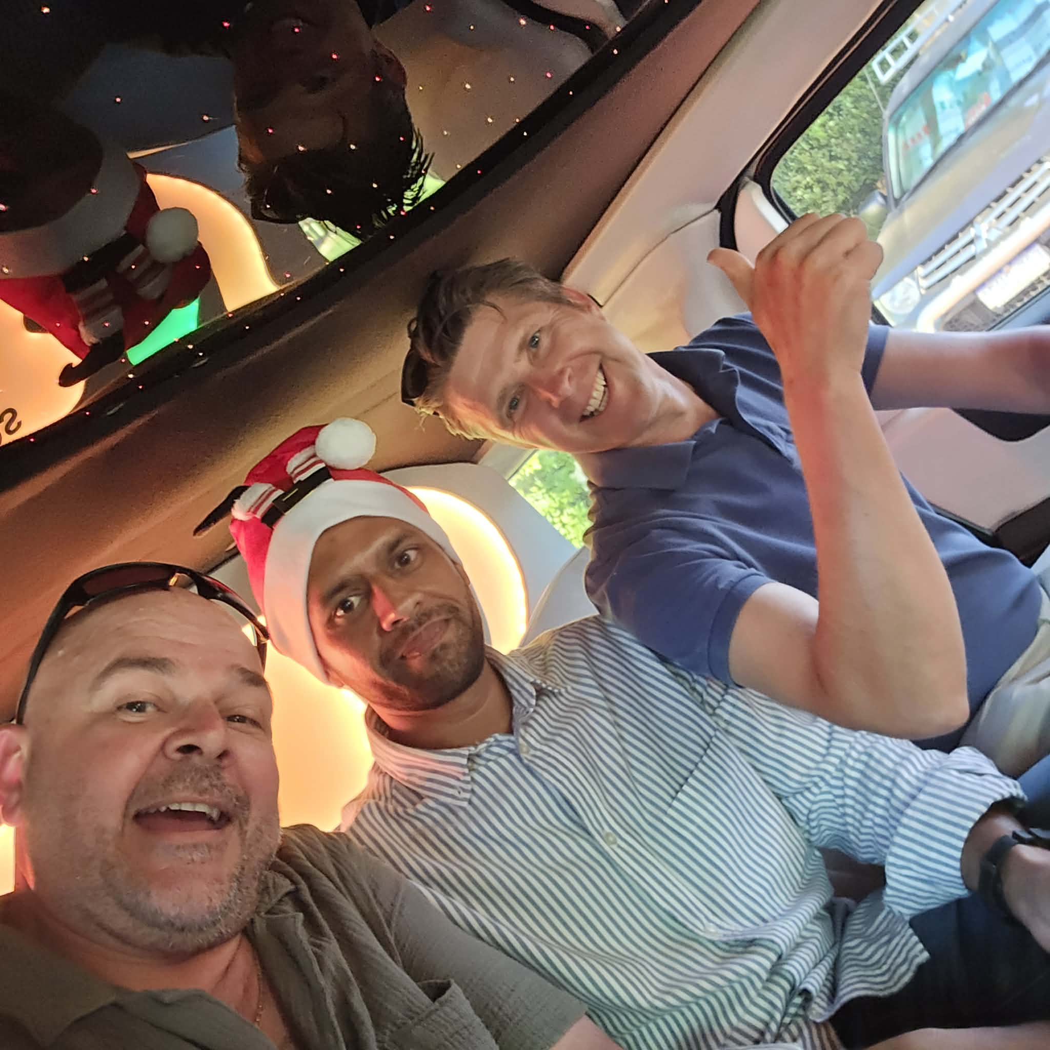 Driving West Christmas limo memories 2025 Driving West team members smiling inside a limousine during their Christmas get-together