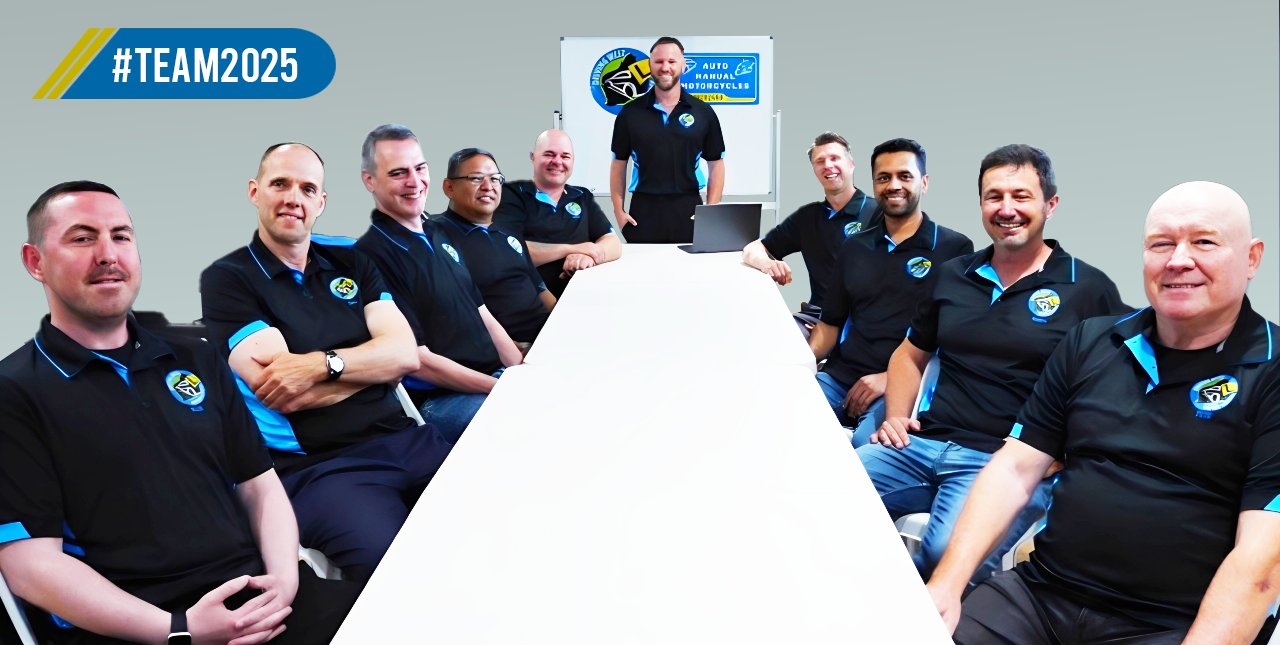 Driving West instructors gathered around the table at a 2025 team meeting