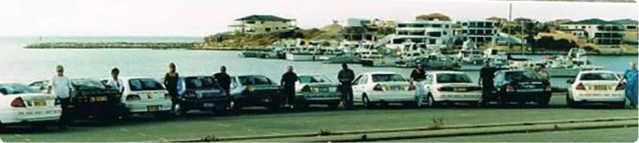 Driving West driving instructors and learner cars at Mindarie Marina in 2000
