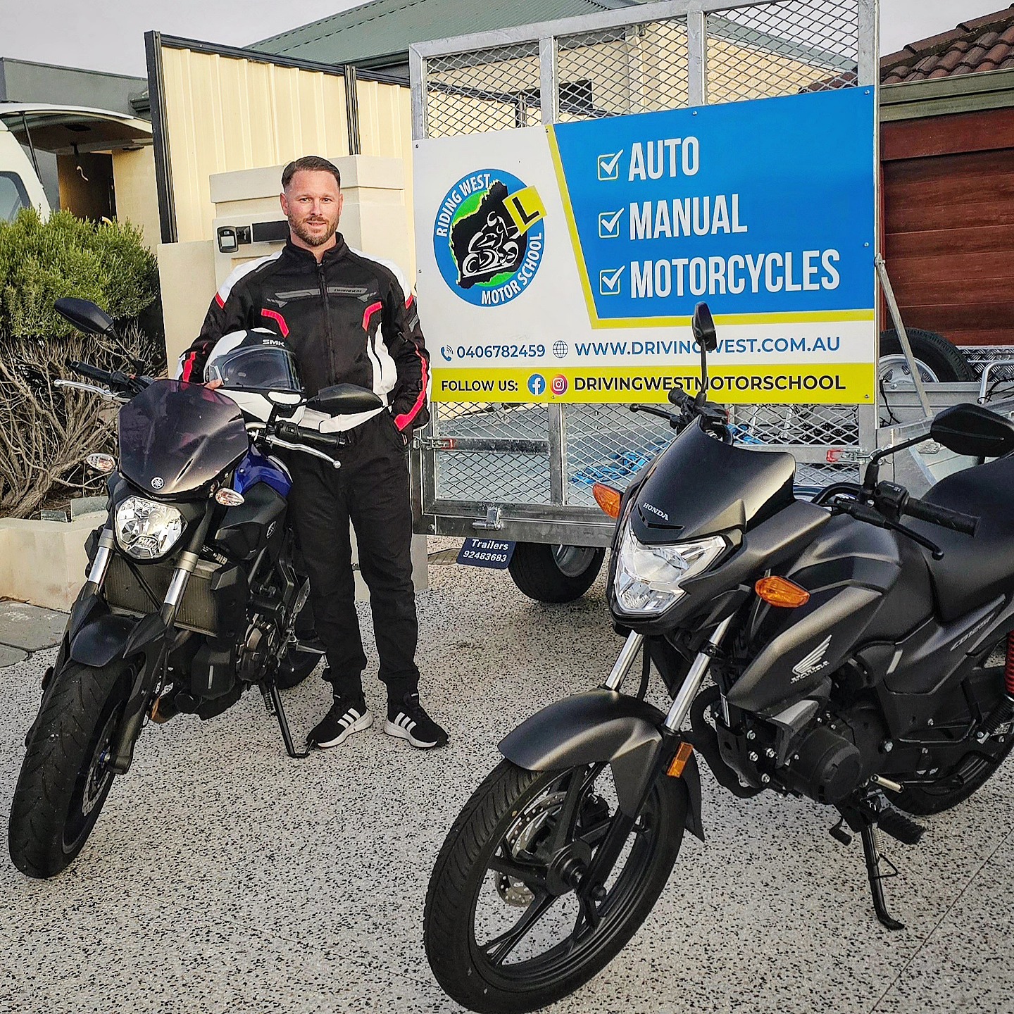 Dirk with motorcycles and the Riding West training trailer